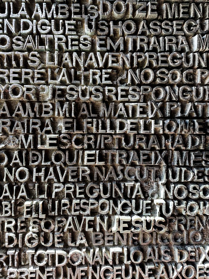 Close-up of a detailed typographic pattern on an ornate textured surface, Barcelona.