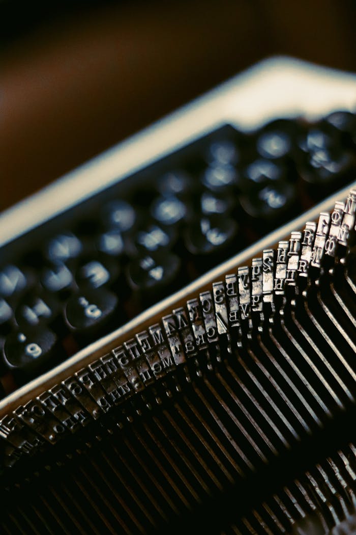 Close-up view of vintage typewriter keys highlighting mechanical details and classic design.